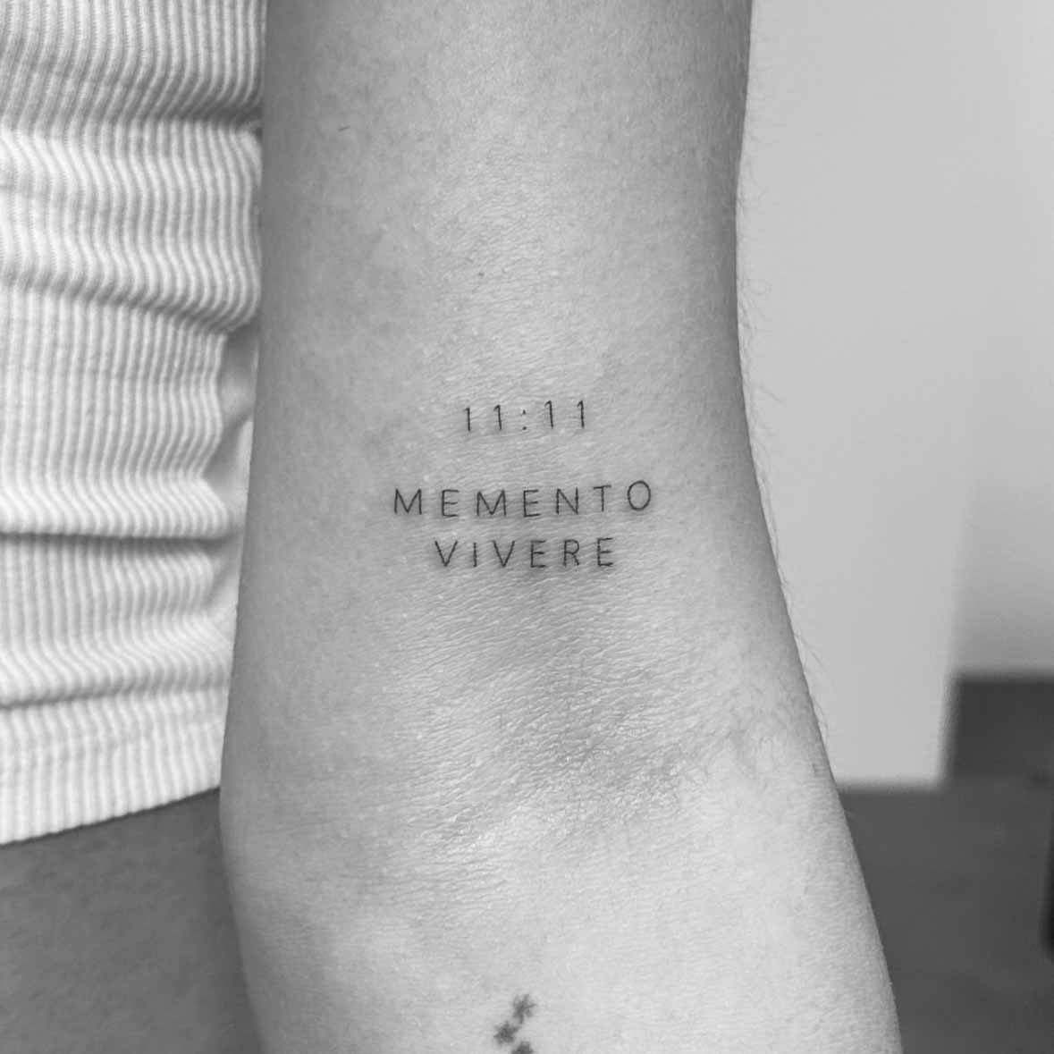 Fine line minimal text tattoo on wrist by Matt Roe, Kensington London