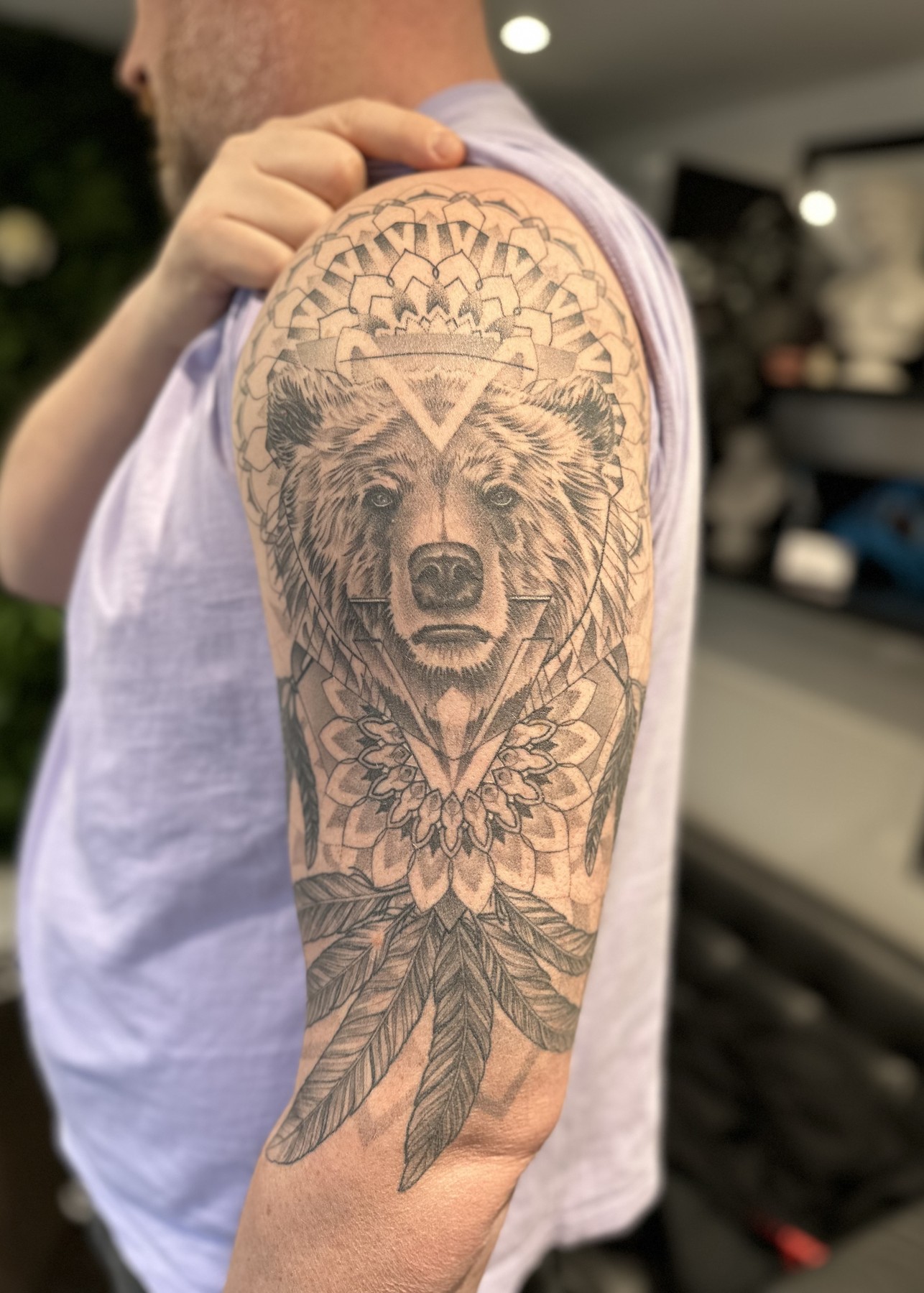 Healed bear and mandala half sleeve tattoo, black and grey by Matt Roe, Kensington London
