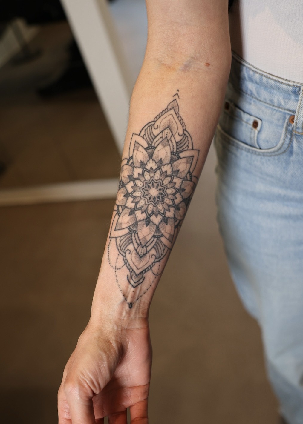 Healed mandala forearm tattoo, black and grey by Matt Roe, Kensington London