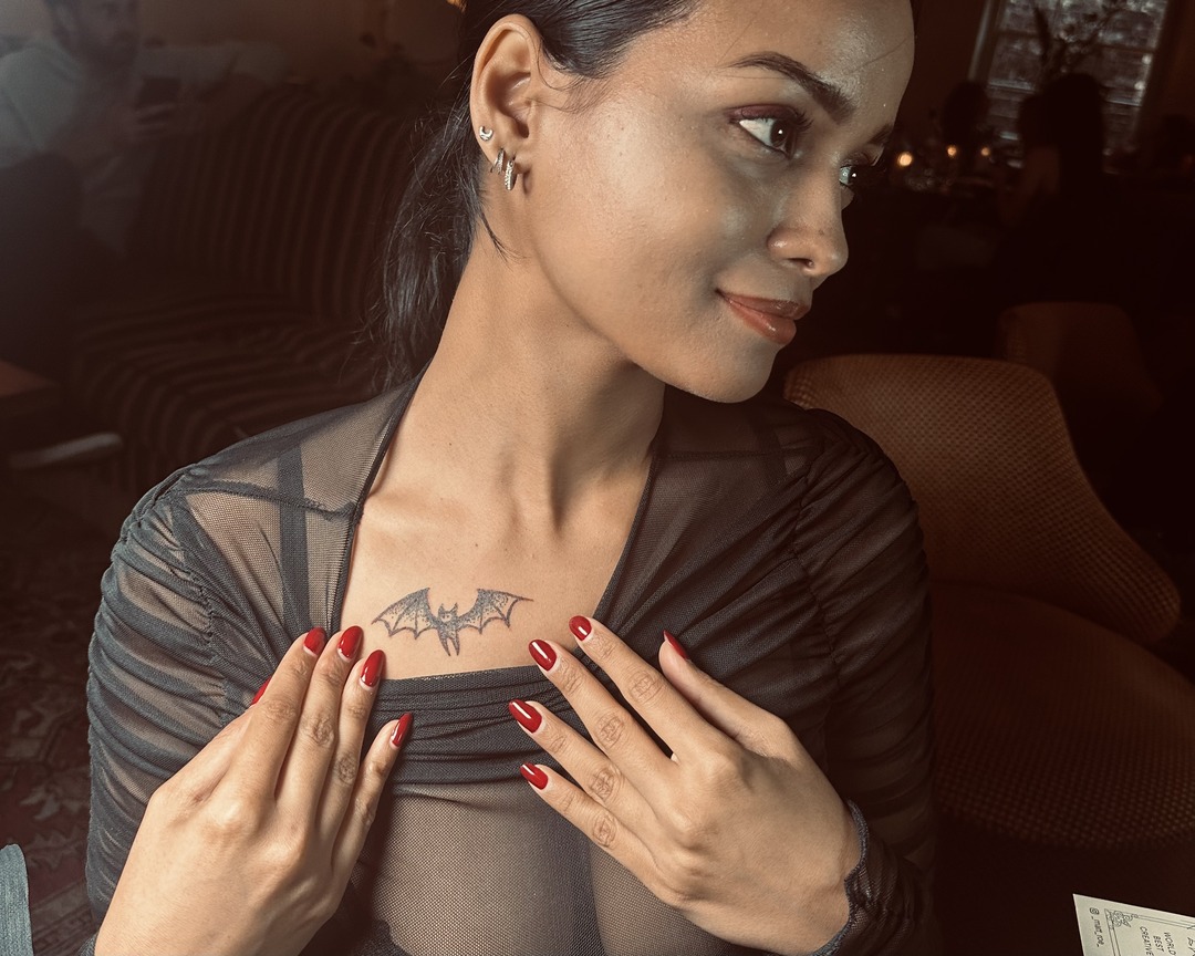 Guest with a fine line bat chest tattoo by Matt Roe