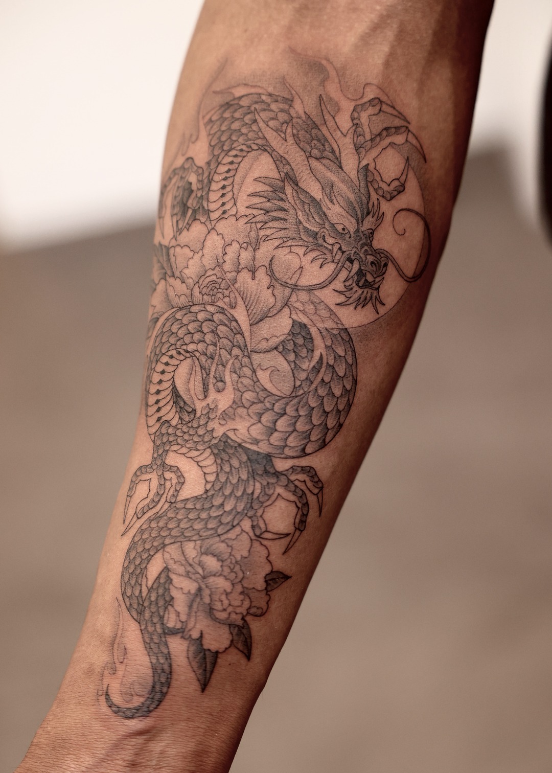 Japanese dragon forearm tattoo, black and grey by Matt Roe, Kensington London