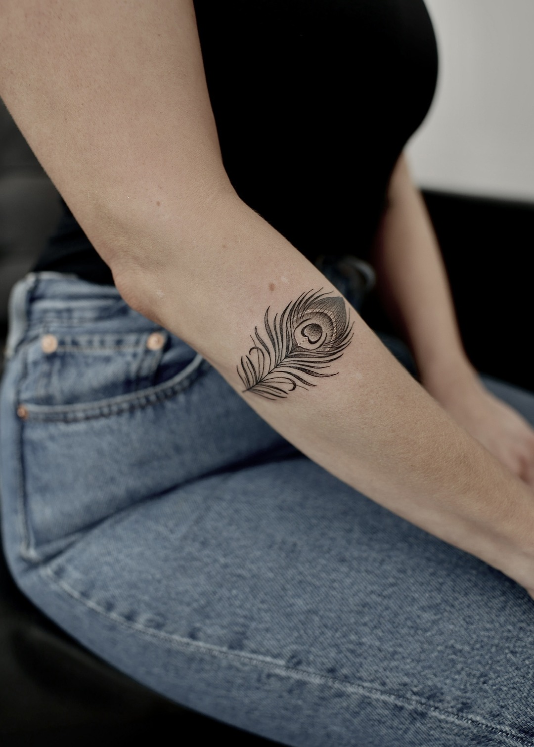 Peacock feather, forearm tattoo, fine line by Matt Roe, Kensington London