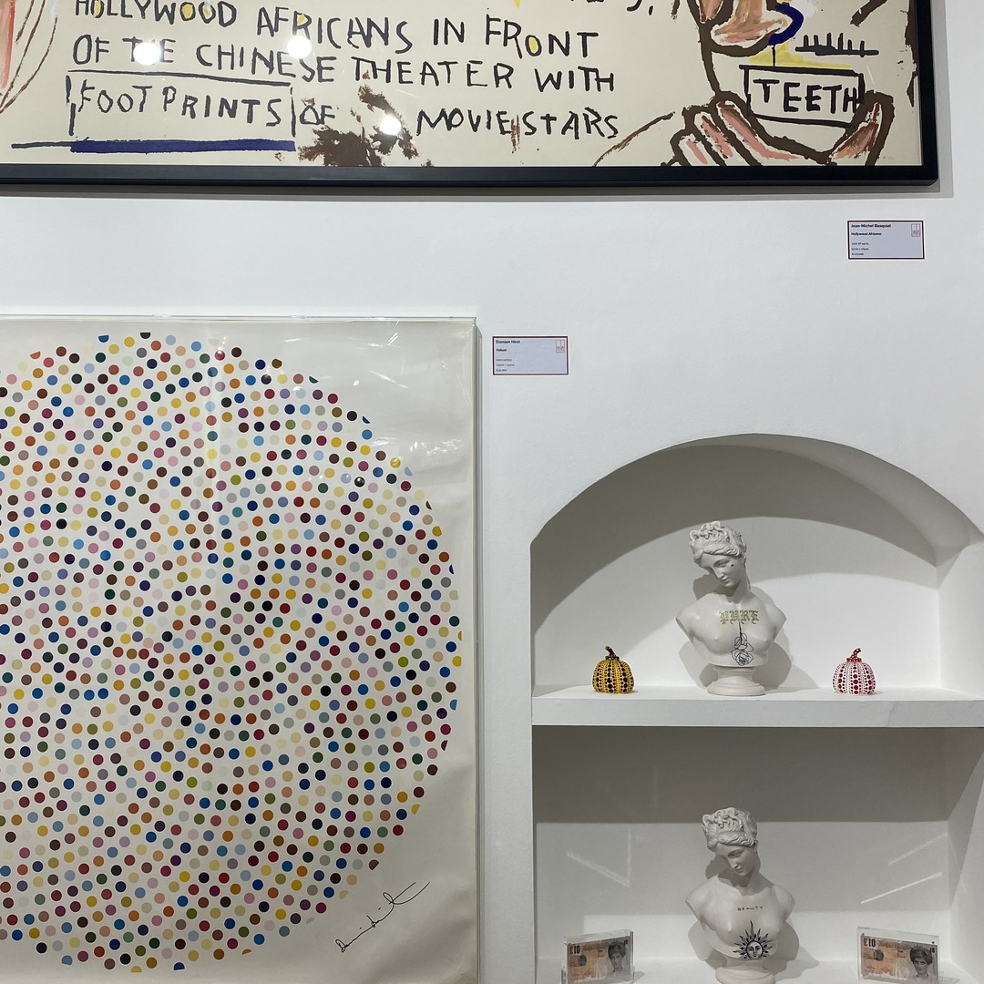 Matt Roe busts displayed with Kusama pumpkins and Banksy works at Red Eight Gallery