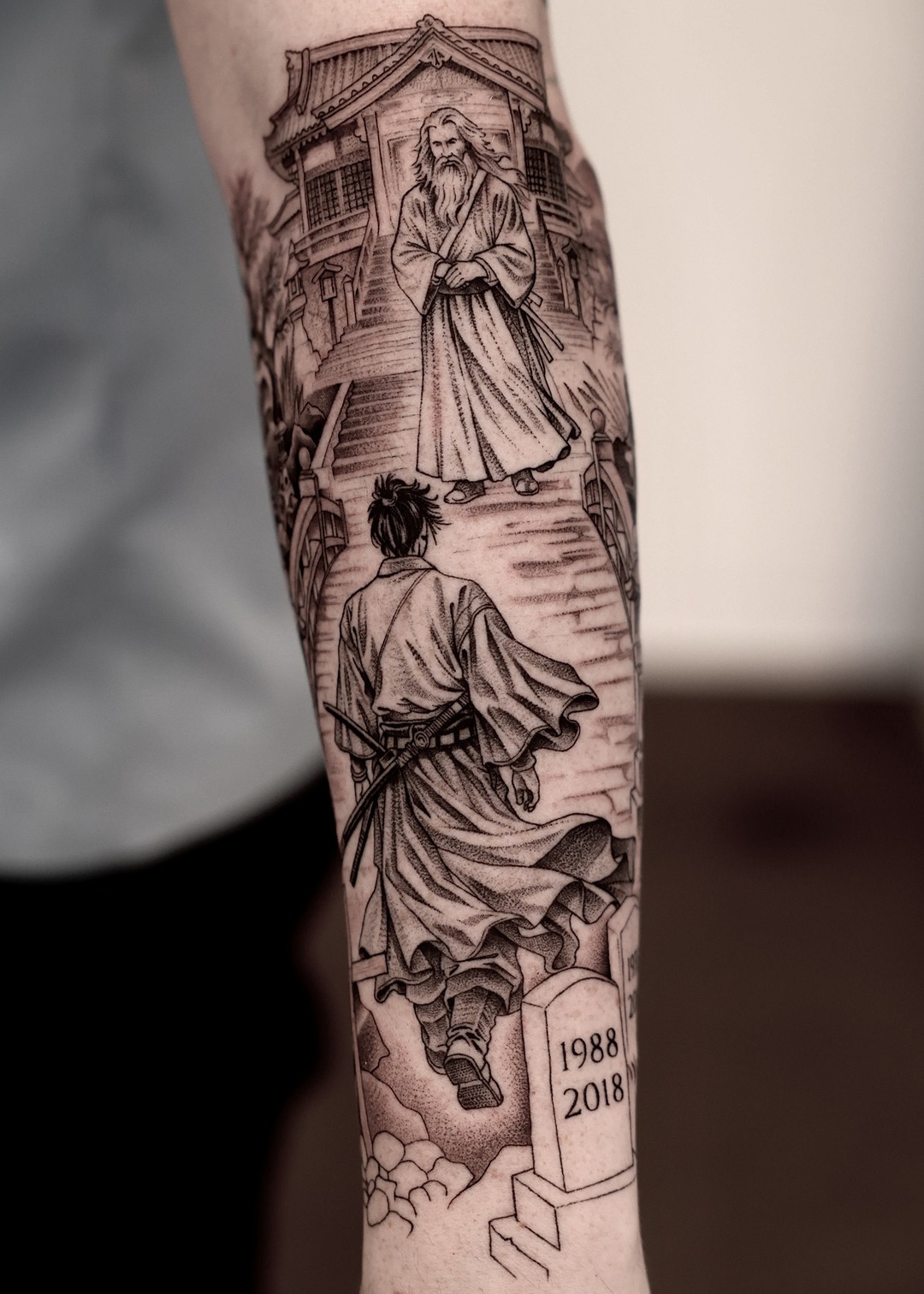 Samurai and sensei at Japanese temple memorial forearm tattoo, black and grey by Matt Roe, Kensington London