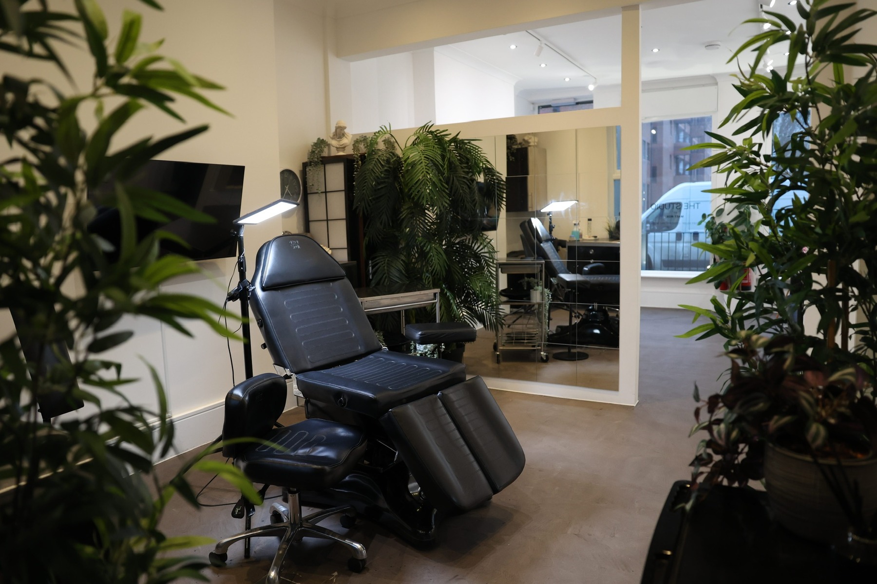 Tattoo chair and mirror in the private Matt Roe studio, Kensington London