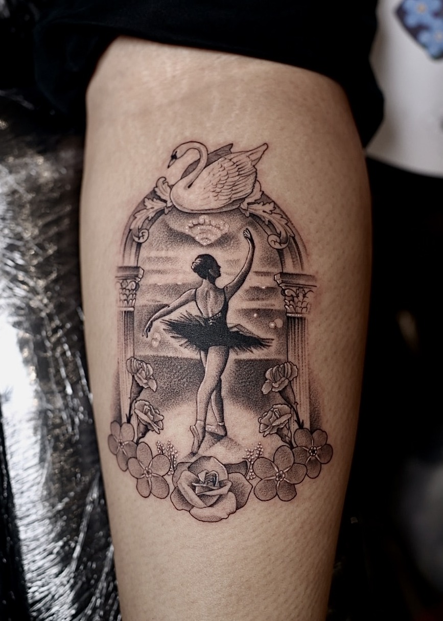Swan Lake ballerina in ornate arch with roses calf tattoo, black and grey by Matt Roe, Kensington London
