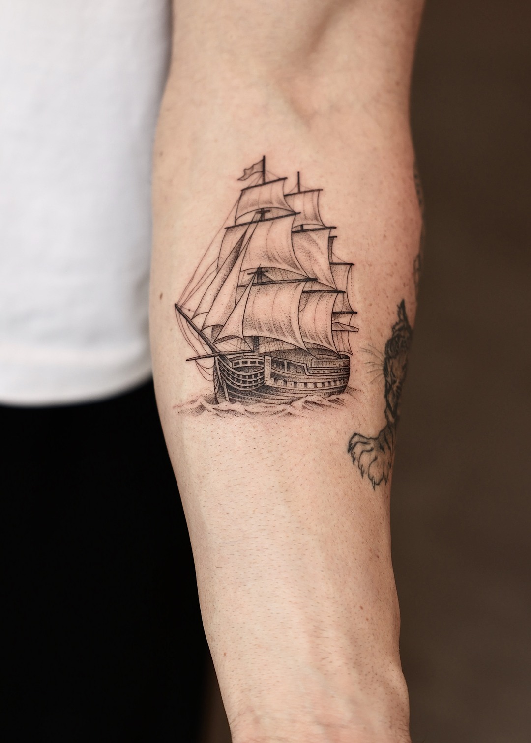 Tall ship galleon on waves forearm tattoo, black and grey by Matt Roe, Kensington London