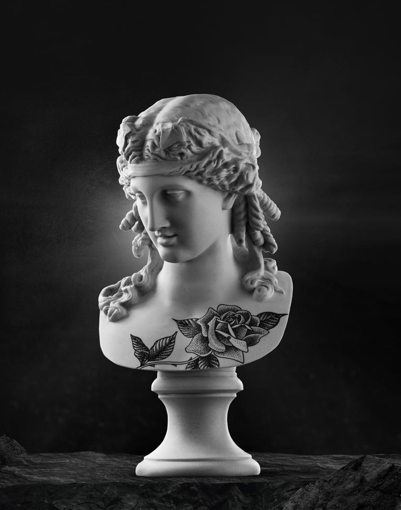 Tattooed female bust with a traditional rose by Matt Roe